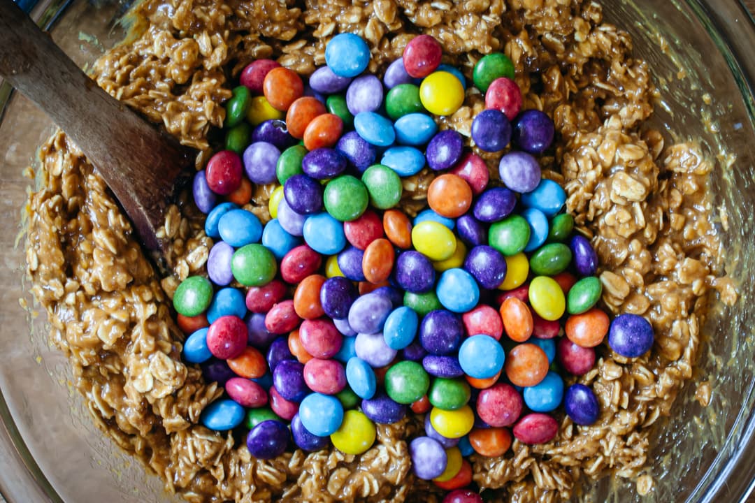 colored candies on top of cookie dough