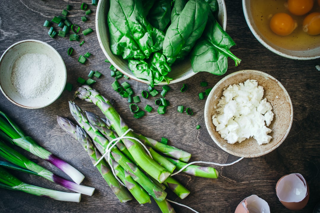 Ingredients for recipe in different size bowls on a wood background