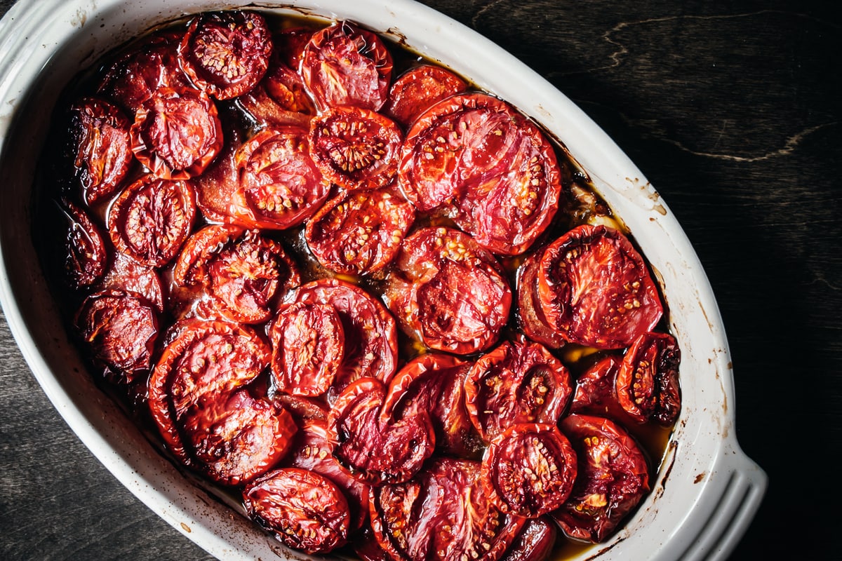 olive oil slow-roasted tomatoes in a gratin dish