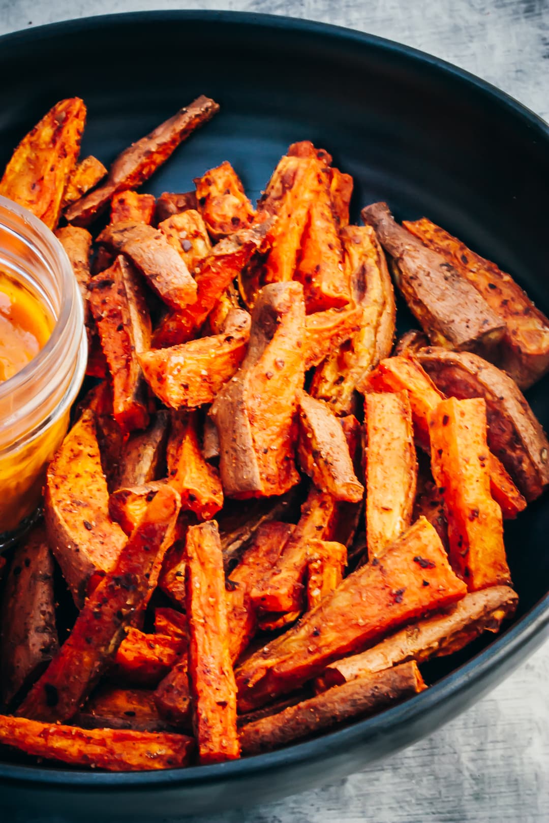 Oven-Baked Sweet Potato fries layered in a serving bowl