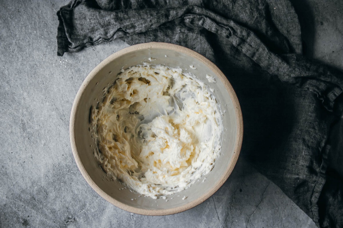 whipped cream cheese in a bowl with a napkin on the side