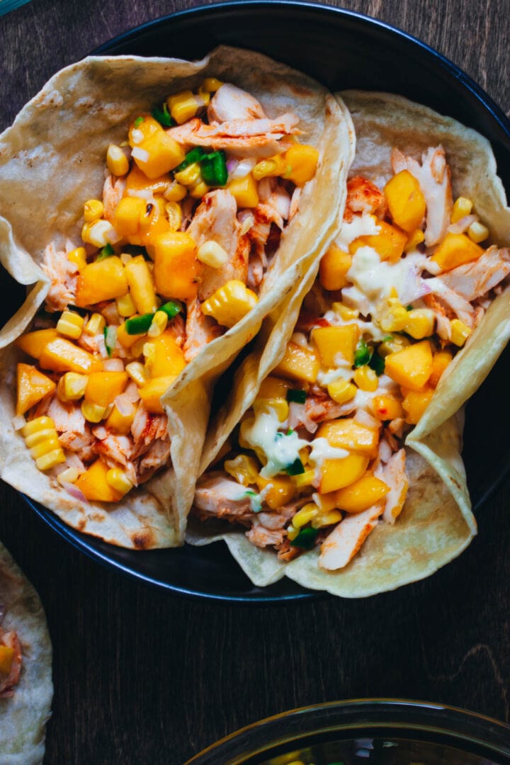 fish tacos with peach salsa in a tortilla