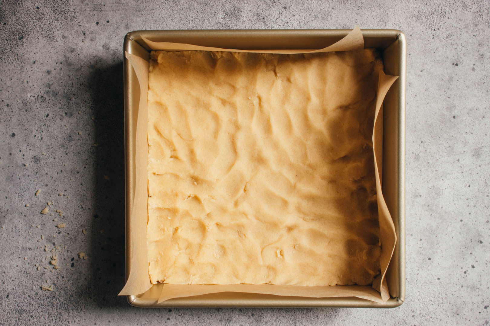 press the shortbread dough into a square baking pan