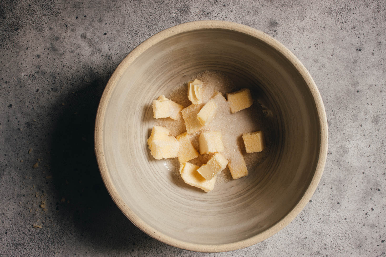 butter and sugar in a large white bowl